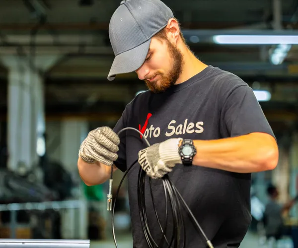 Voto technician assembling a cable